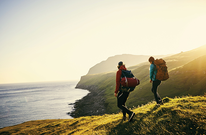 couple hiking at sunrise